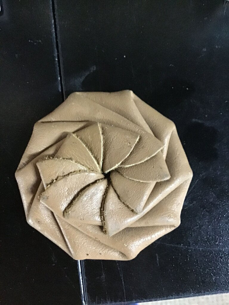 Leather pinwheel style squeeze coin pouch