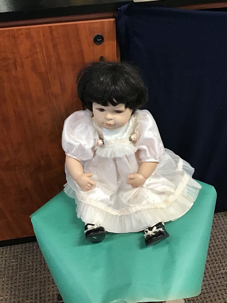 Porcelain Doll in White Dress