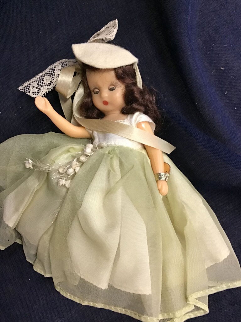 Vintage Doll with Green Dress and Hat