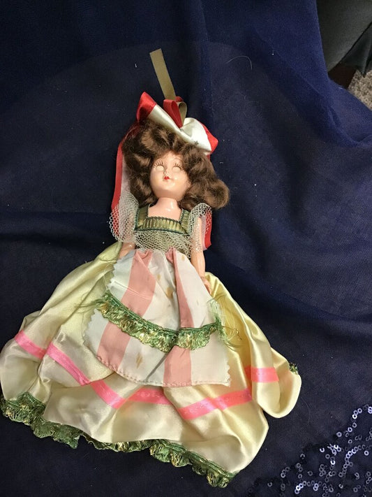 Vintage Doll with Brown Curls and Colorful Dress