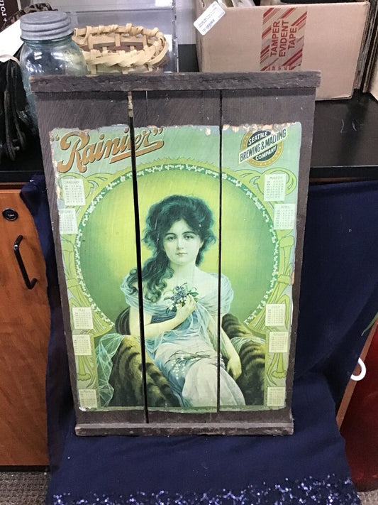 Vintage wooden advertising cabinet door Rainier Brewing 1910 calendar reproduction